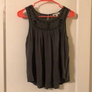 Olive green sleeveless shirt.